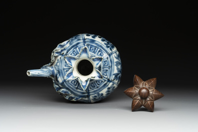 A fine Chinese blue and white 'pomegranate' kendi and a wooden cover, Wanli