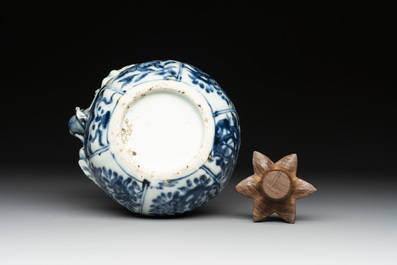 A fine Chinese blue and white 'pomegranate' kendi and a wooden cover, Wanli
