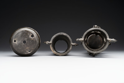 Two Chinese Chinese bronze cylindrical incense stick holders and a covered censer, Yuan/Ming and Qing