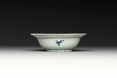 A group of thirteen Chinese blue, white and famille rose plates and a bowl, late Ming/early Qing