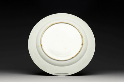 A Chinese famille rose dish and four plates with floral design, Qianlong