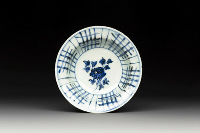 A group of thirteen Chinese blue, white and famille rose plates and a bowl, late Ming/early Qing