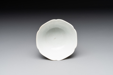 A Chinese polychrome cup and saucer with figures and a dog, Yongzheng
