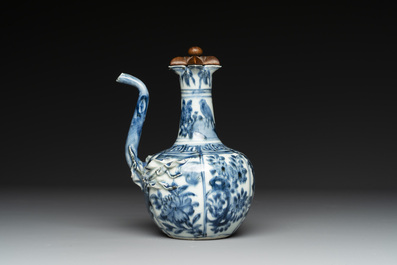A fine Chinese blue and white 'pomegranate' kendi and a wooden cover, Wanli