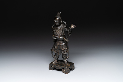 A fine Chinese bronze figure of a divinity, Ming