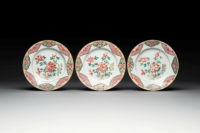 Two sets of six Chinese famille rose plates with peonies, Yongzheng/Qianlong