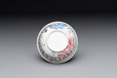 A Chinese famille rose cup and saucer with music making ladies, Yongzheng/Qianlong