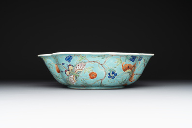 A set of 14 Chinese turquoise-ground famille rose dinner service, Qianglong mark, 19th C.