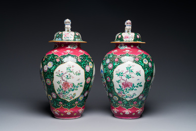 A pair of Chinese famille rose black-ground jars and covers with mountainous landscape design, Yongzheng