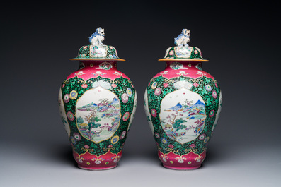 A pair of Chinese famille rose black-ground jars and covers with mountainous landscape design, Yongzheng