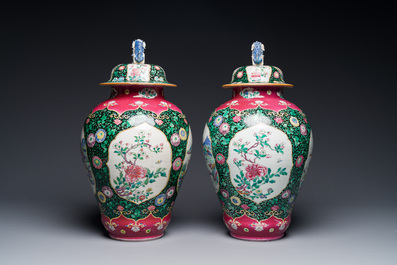 A pair of Chinese famille rose black-ground jars and covers with mountainous landscape design, Yongzheng