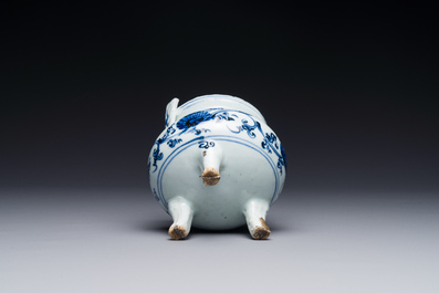 A Chinese blue and white tripod censer with floral design and a wooden cover, Ming