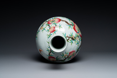 A Chinese famille rose relief-moulded 'tianqiuping' vase with nine peaches, Qianlong mark, 19/20th C.