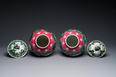 A pair of Chinese famille rose black-ground jars and covers with mountainous landscape design, Yongzheng