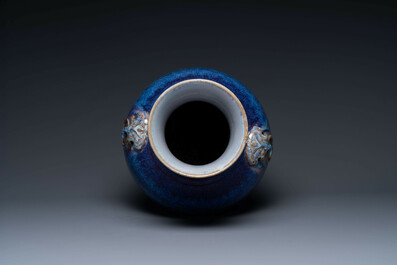 A large Chinese flamb&eacute; glaze 'hu' vase with Taotie handles, Qing