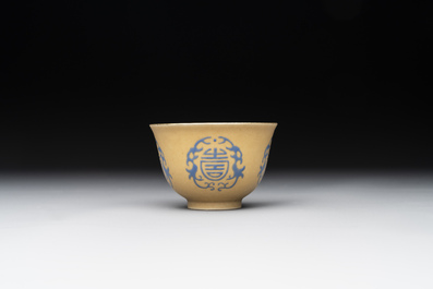 A Chinese blue enamel on gilt &lsquo;Shou&rsquo; cup, 19th C.