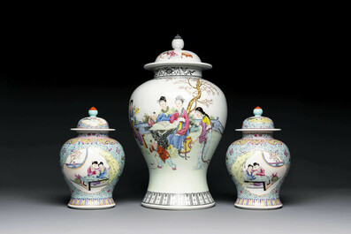 A Chinese famille rose covered vase and a pair of small covered vases, Qianlong mark, 20th C.