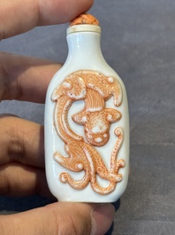 A Chinese moulded iron-red 'chilong' snuff bottle, 19th C.