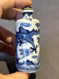 Two Chinese blue and white snuff bottles and two blue, white and copper-red snuff bottles, 19th C.