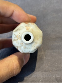 A Chinese iron-red and grisaille snuff bottle with monkeys at the Shuilian cave, 19th C.
