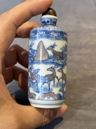 Three Chinese blue, white and copper-red snuff bottles, Yongzheng mark, 19/20th C.