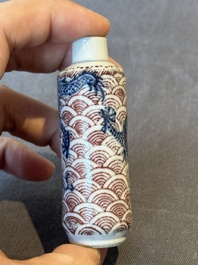 Two Chinese blue and white snuff bottles and two blue, white and copper-red snuff bottles, Yongzheng and Qianlong mark, 19th C.