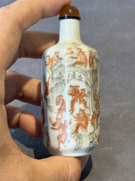 A Chinese iron-red and grisaille snuff bottle with monkeys at the Shuilian cave, 19th C.