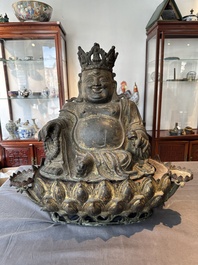 An important and large Chinese gilt bronze Buddha on a lotus throne, Ming