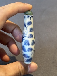 Two Chinese blue, white and copper-red snuff bottles and a blue and white 'crab' snuff bottle, Chenghua and Qianlong mark, 19th C.
