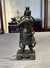 A fine Chinese bronze figure of a divinity, Ming
