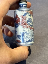 Three Chinese blue, white and copper-red snuff bottles, 19th C.