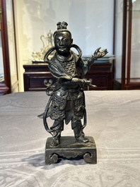 A fine Chinese bronze figure of a divinity, Ming