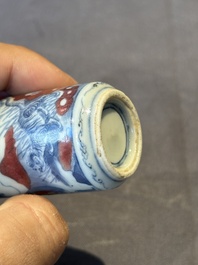 Three Chinese blue, white and copper-red snuff bottles, 19th C.