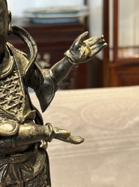 A fine Chinese bronze figure of a divinity, Ming