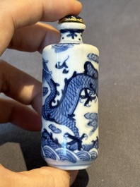 Two Chinese blue and white snuff bottles and two blue, white and copper-red snuff bottles, 19th C.