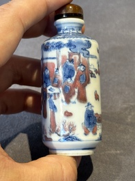 Three Chinese blue, white and copper-red snuff bottles, 19th C.