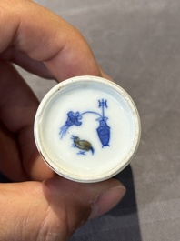 Two Chinese blue and white snuff bottles and a blue, white and copper-red snuff bottle, Yongzheng mark, 19th C.
