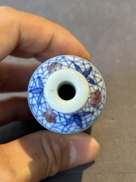 Two Chinese blue, white and copper-red snuff bottles and a blue and white 'crab' snuff bottle, Chenghua and Qianlong mark, 19th C.