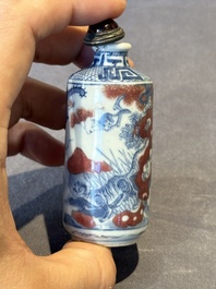 Three Chinese blue, white and copper-red snuff bottles, 19th C.