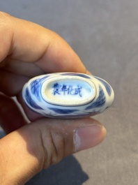 Two Chinese blue, white and copper-red snuff bottles and a blue and white 'crab' snuff bottle, Chenghua and Qianlong mark, 19th C.