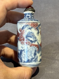 Three Chinese blue, white and copper-red snuff bottles, 19th C.