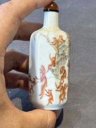A Chinese iron-red and grisaille snuff bottle with monkeys at the Shuilian cave, 19th C.