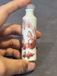 A Chinese copper-red snuff bottle with travellers in a landscape, Qianlong mark, 19th C.