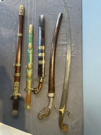 A silver plated dagger and four swords, China, Burma and Indonesia, 18/19th C.