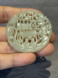 Two Chinese round jade plaques on carved wooden stands, 19th C.