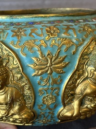 A Chinese gilt and champlev&eacute; enamelled bronze bowl with Buddhas in relief, 19/20th C.