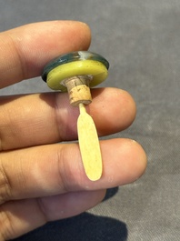 A Chinese yellow jade snuff bottle with moss agate cover and bone stopper, 19th C.