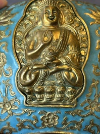 A Chinese gilt and champlev&eacute; enamelled bronze bowl with Buddhas in relief, 19/20th C.