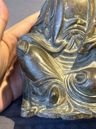 A rare Chinese parcel-gilt and lacquered pewter Guanyin, 17/18th C.