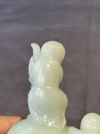 A Chinese celadon jade group of two boys cleansing an elephant, 18th C.